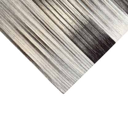 Kilim rug with a gray striped pattern, diagonal view of the woven edges