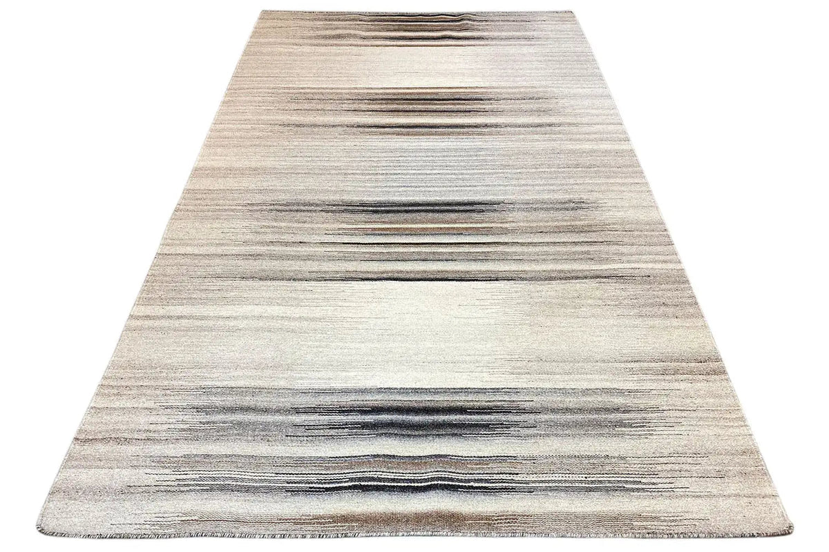 Triangular view of a kilim rug: beige areas with horizontal stripes