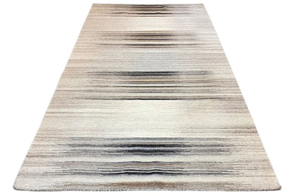 Triangular view of a kilim rug: beige areas with horizontal stripes