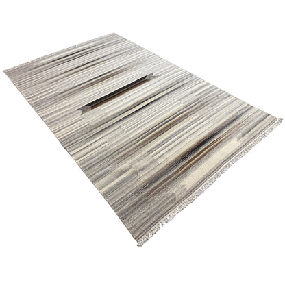Kilim dhurrie rug in beige-gray with lengthwise stripes, three-quarter view