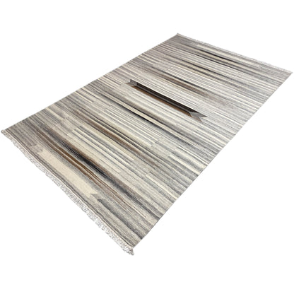 Kelim dhurrie rug with stepped stripes in gray and beige, arranged diagonally