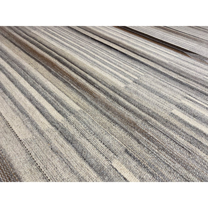 Close-up of a kilim-dhurrie rug: fine, lengthwise stripes in gray and beige