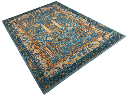 Teppich mit dichtem blau-goldenem Blumenmuster und gerahmter Mittelzone