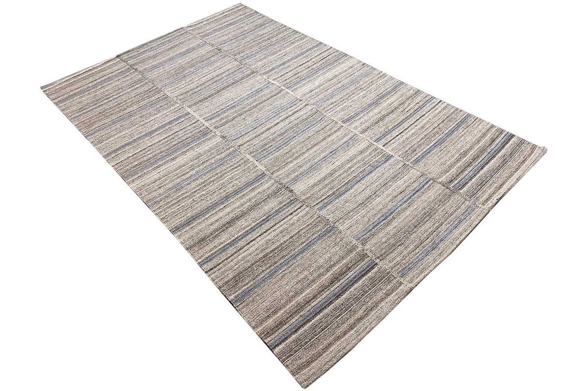 Kilim rug, diagonal view, geometric checked pattern in gray, beige, and blue