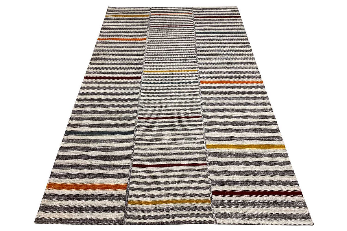 Dhurrie rug with striped bands, a gray-beige base, and multicolored accents