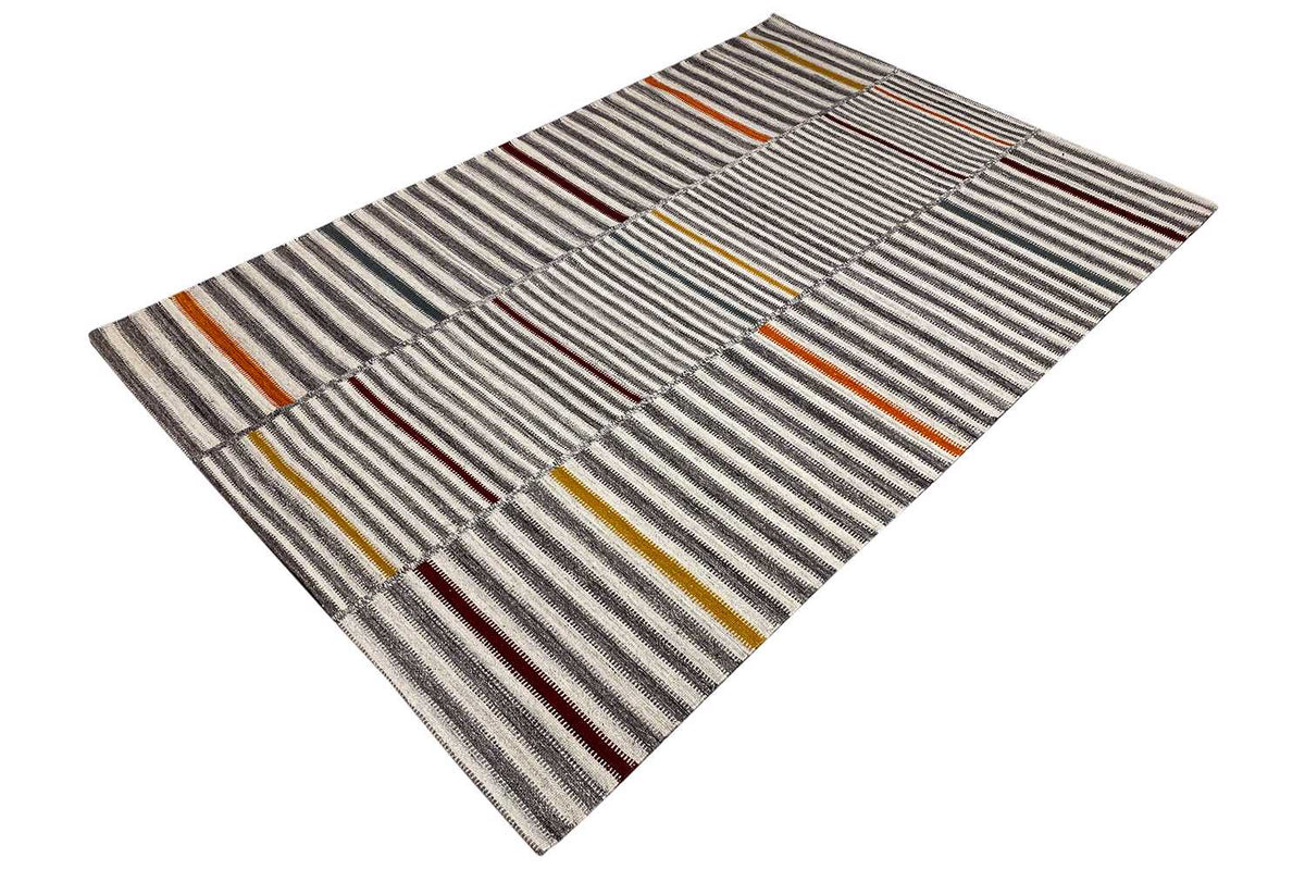 Kilim rug, shown folded, horizontal stripes in gray and beige with yellow-red accents