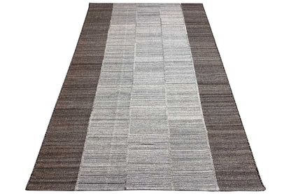 Carpet in diagonal view: light gray central area, dark edge strips, rectangular