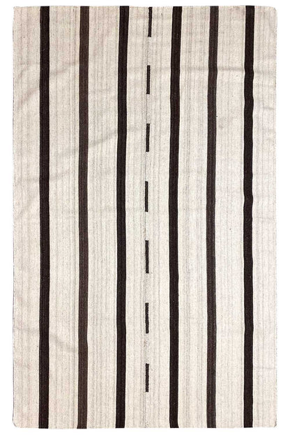 Modern kilim rug with a light beige base and black stripes, rectangular.