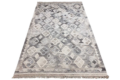 Dhurri/Kelim rug with an abstract diamond and square pattern in light gray and cream, fringes