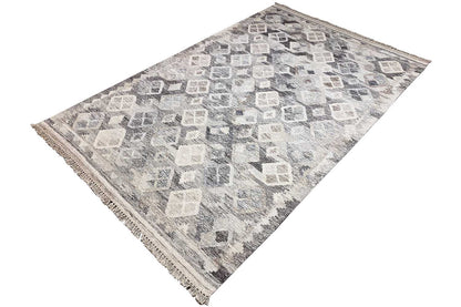Rectangular kilim rug with a gray and cream square diamond pattern, fringes