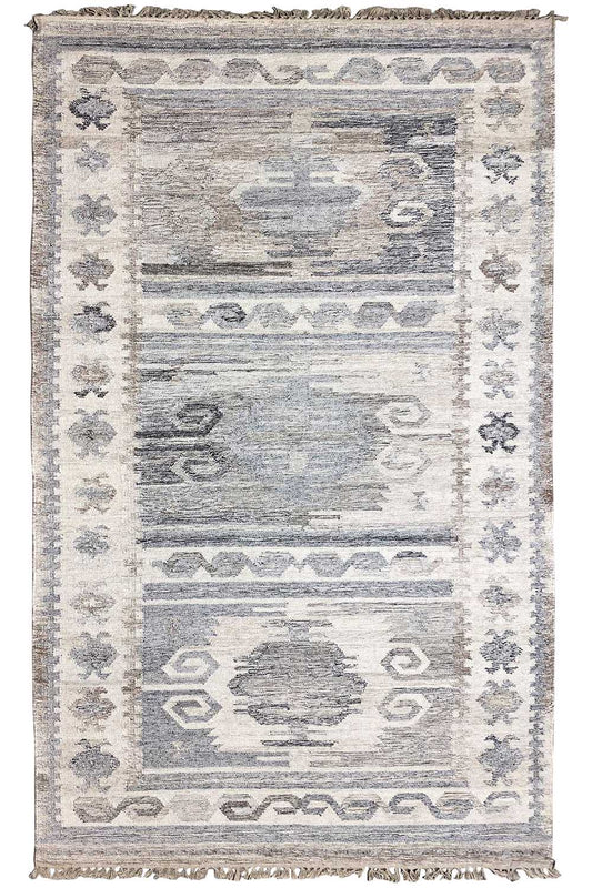 Modern kilim dhurrie rug with a geometric pattern, light gray-blue tones, and fringes