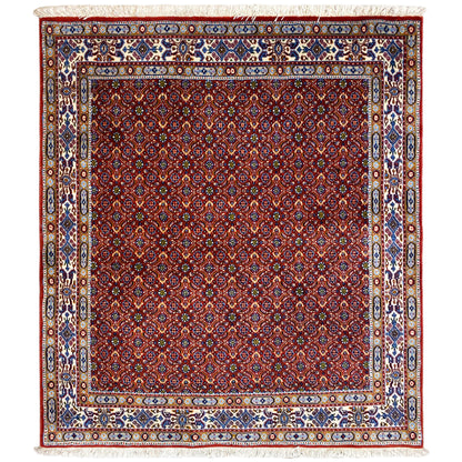 Oriental rug 132x122 cm with a red medallion pattern and multicolored border