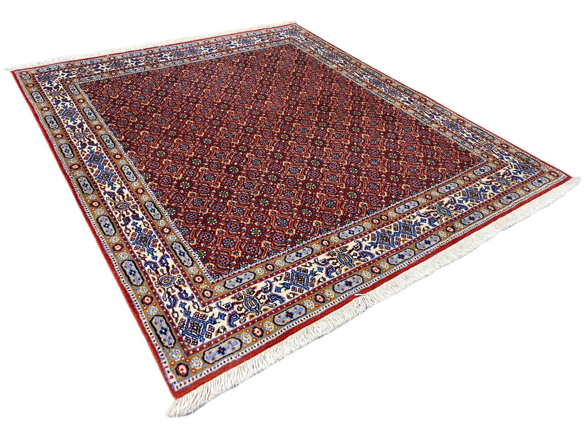 Oriental rug 132x122 cm, red all-over pattern with border and frayed edges