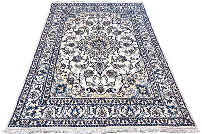 Rectangular Nain rug with blue-and-white Baroque ornaments, decorative border, and pile look.