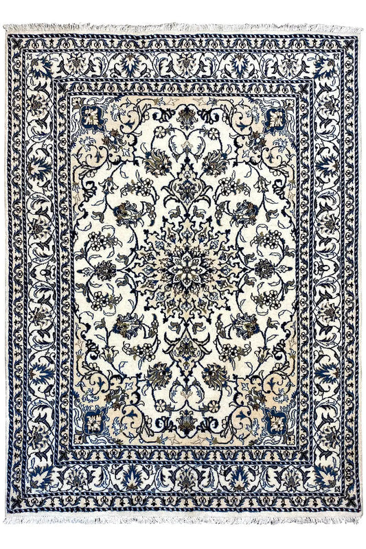 Rectangular blue-and-white Nain rug with an ornamental medallion, surrounding border, and finished edges.
