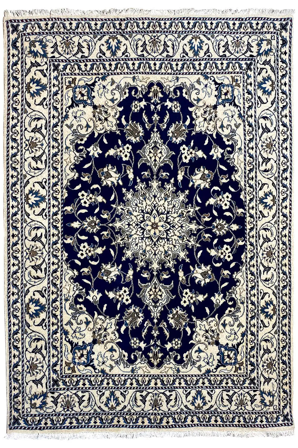 Nain rug with a symmetrical medallion pattern in blue and cream, wide ornamental border