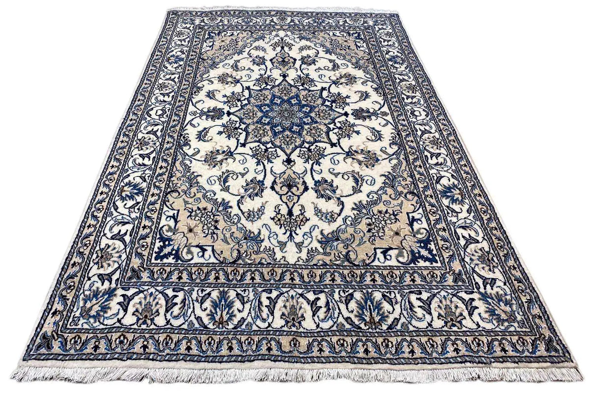 Nain rug, rectangular, blue-and-white ornamental pattern with decorative border and fringed edge