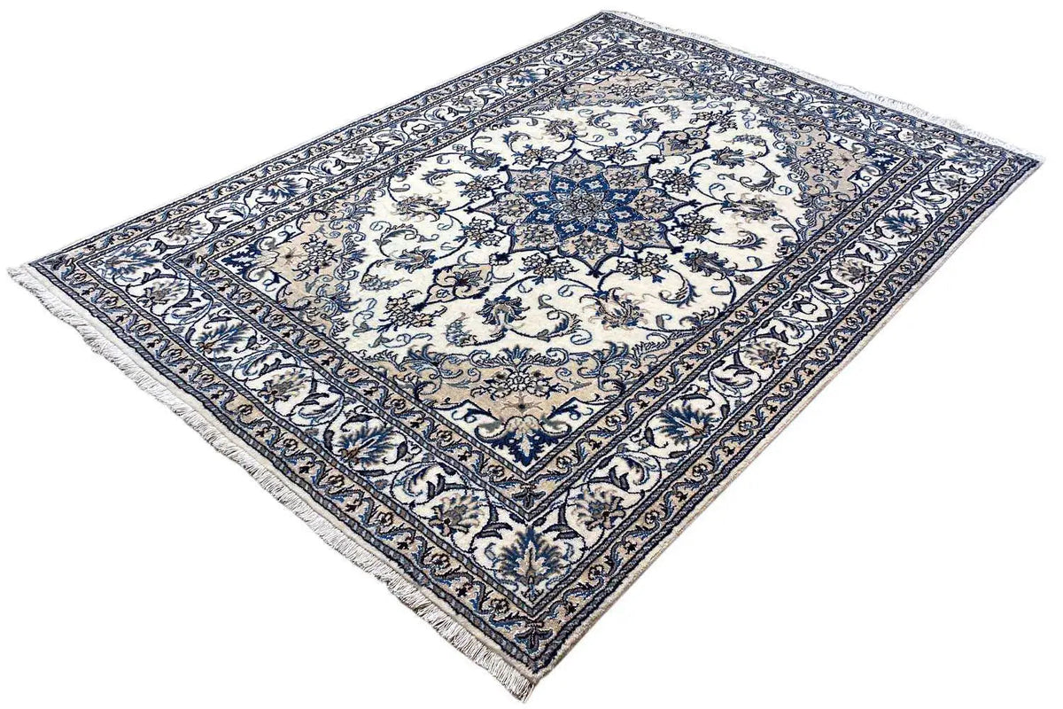 Nain rug, blue-and-white floral pattern in the central square, bordered with vines