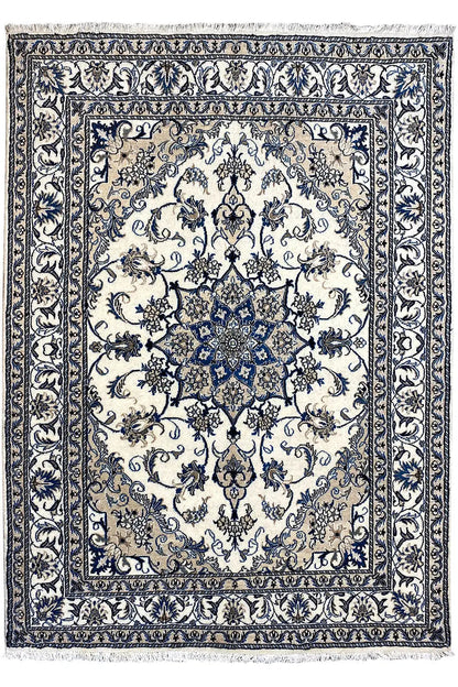 Nain rug with central blue medallion, delicate ornamental pattern and decorative border