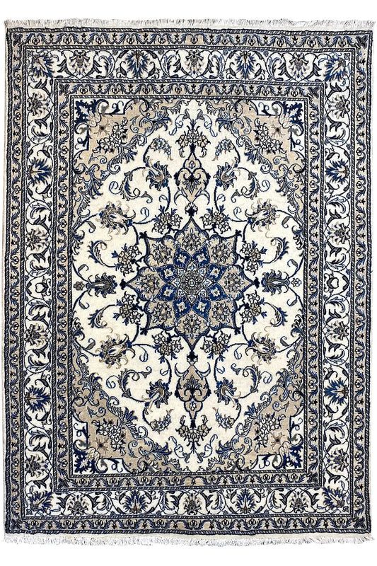 Nain rug with central blue medallion, delicate ornamental pattern and decorative border