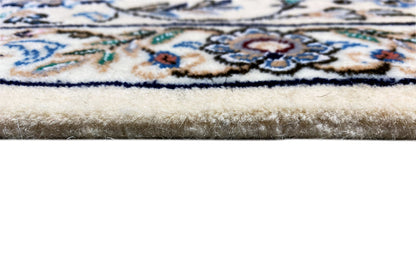 Rug edge with short pile and a bound border in blue, beige, and brown, fringes