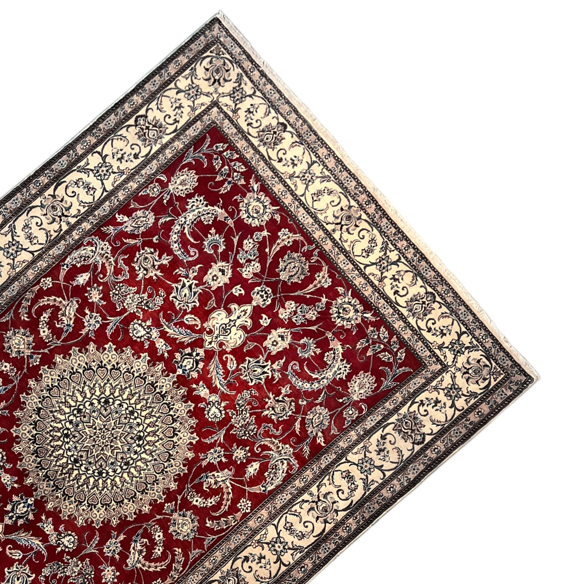 Top view: red Nain rug with fine white ornaments, a central medallion, and a corner border