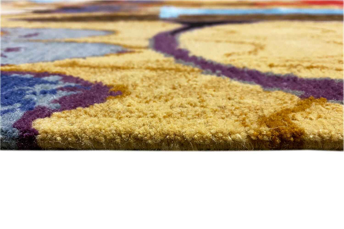 Close-up of the carpet edge: multicolored pattern, high-quality pile surface