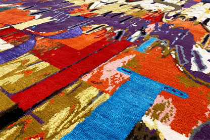 Close-up of the pile: abstract color fields in shades of blue, red, purple, and gold