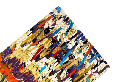 Top view: designer rug with a graphic ornamental pattern in blue, red, and cream