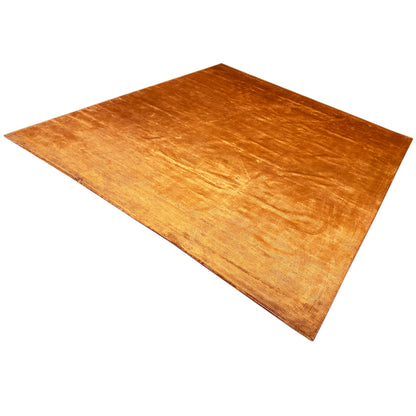 Carpet in golden-brown orange with a brushed look and a dense, fine surface.