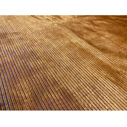 Yellow-brown carpet with purple vertical lines; brushed pile surface visible.