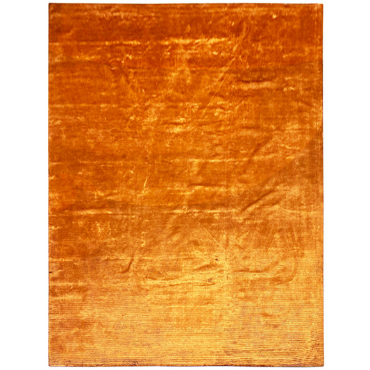 Rug in vivid orange with a delicate, glossy-looking raised texture.