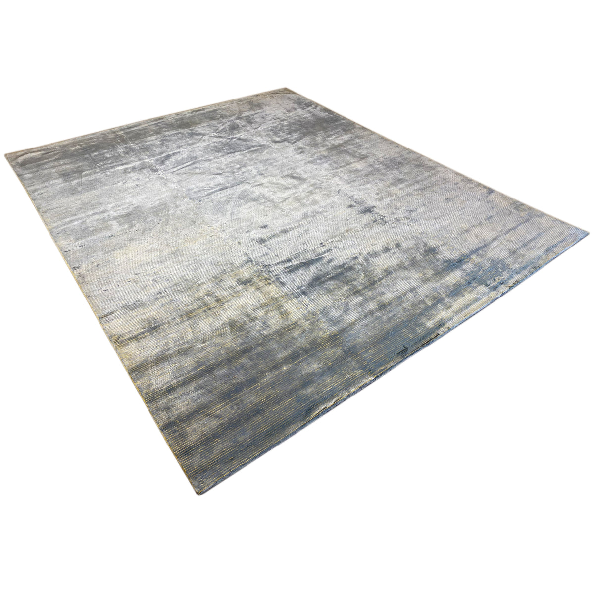 Oblique view: Light gray-blue rug with a distressed, faded vintage look
