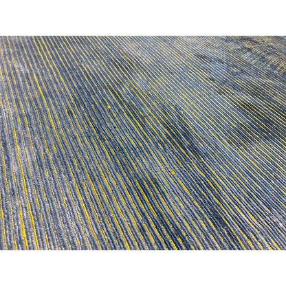 Close-up: Dense linear pattern in blue with yellow accents on short pile