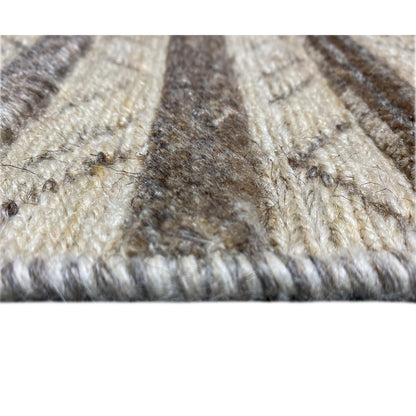 Texture details of the carpet: dense, plush material with beige and brown sections