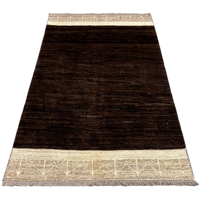 Nimbaft rug in a trapezoidal view: dark brown pile design with a beige border