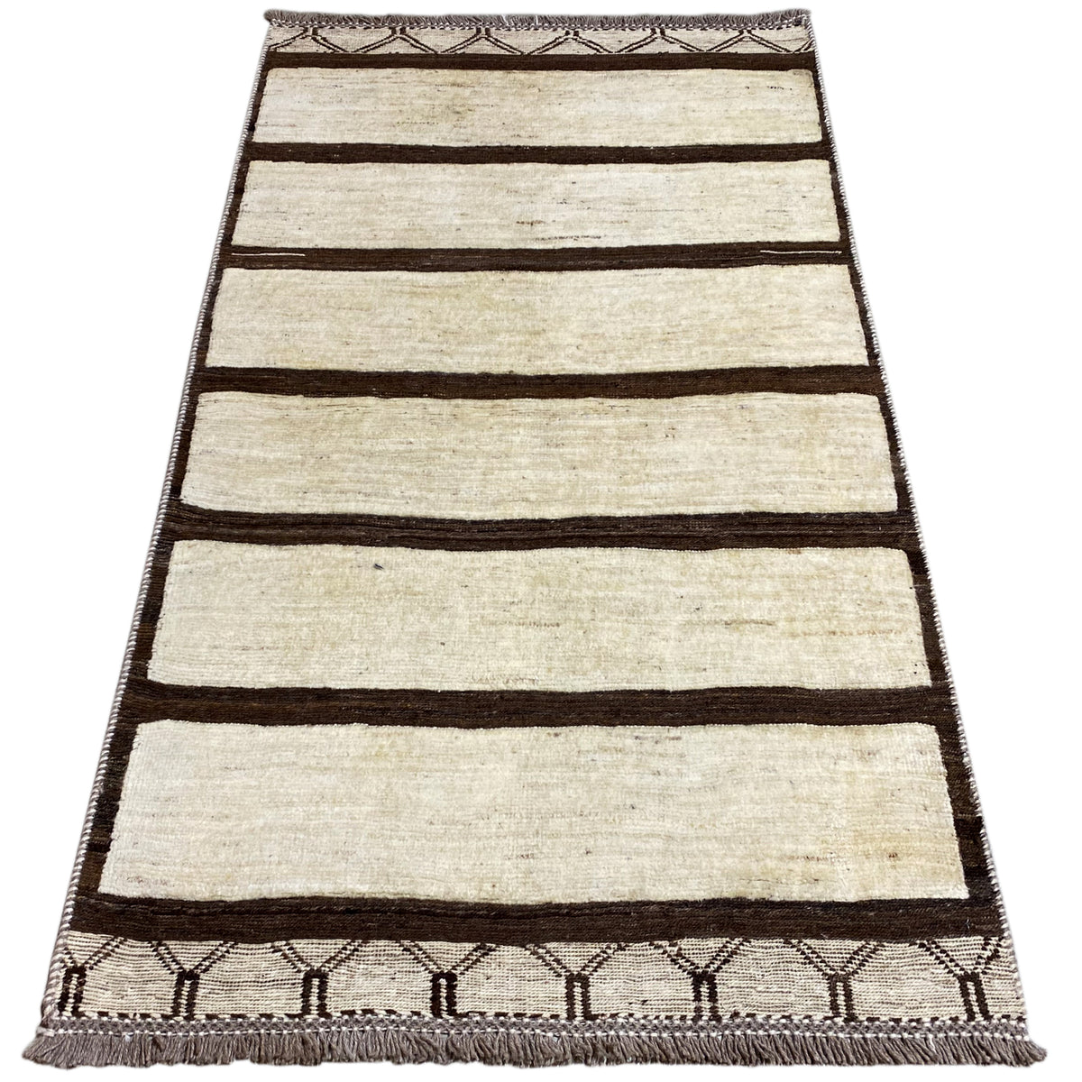 Nimbaft rug 161x92 cm with wide brown stripes on a beige background