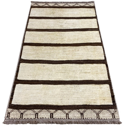Nimbaft rug 161x92 cm with wide brown stripes on a beige background