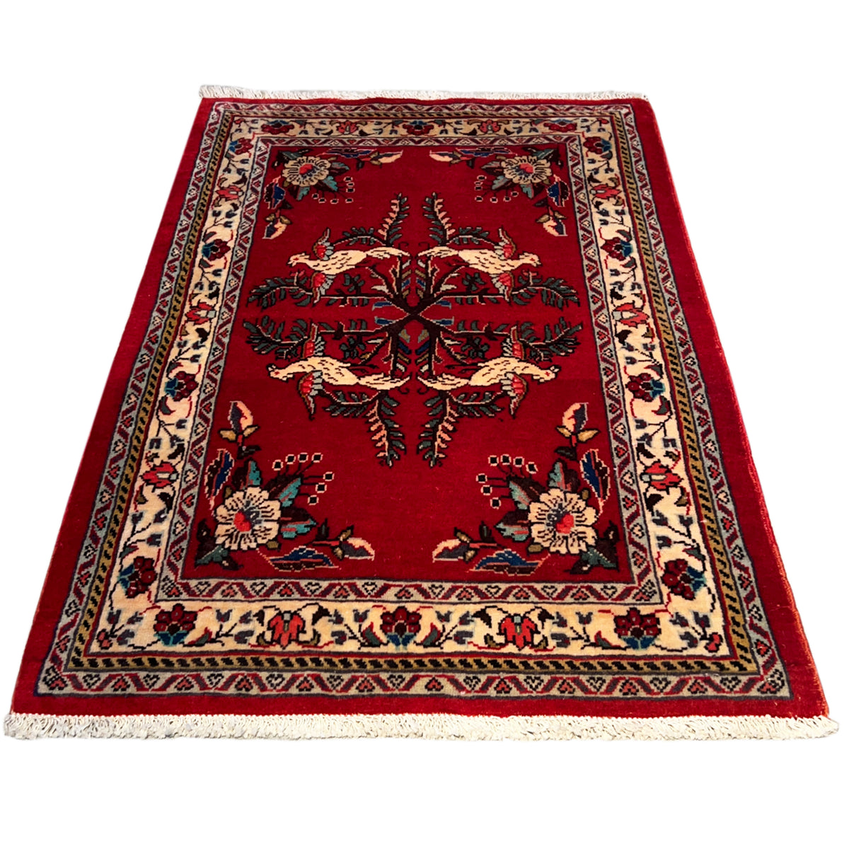 Portrait-oriented red carpet with a central tree and animal motif and a colorful border