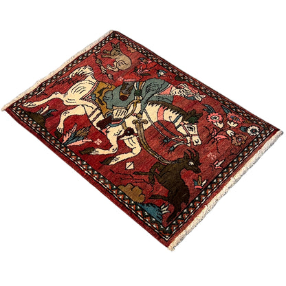Reddish-brown Hamedan rug with a border frame and figures in ivory, blue, and green