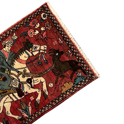 Detail view: Hamedan rug with figures, floral motifs, and a dark decorative border