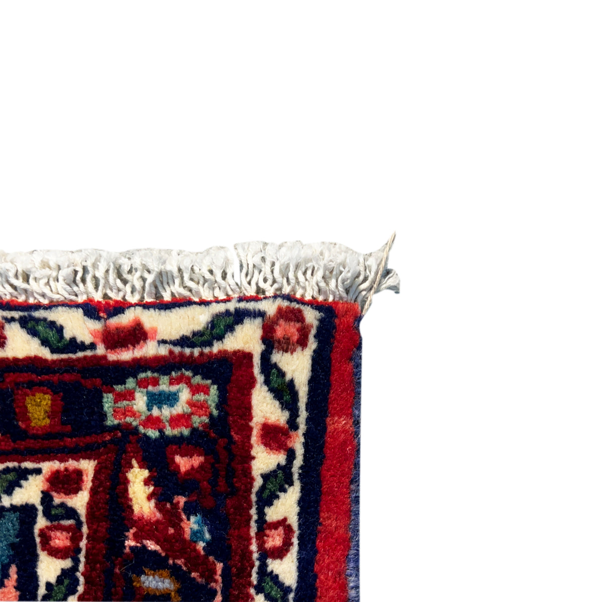 Poshti rug edge with white fringes and a red woven section