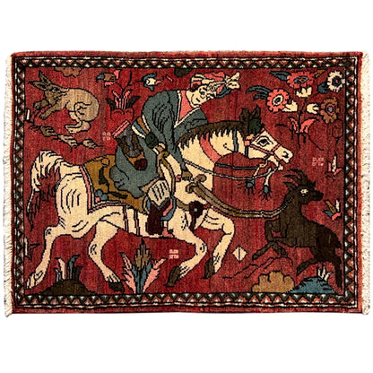 Red Hamedan rug with an ornate border and detailed figurative motifs