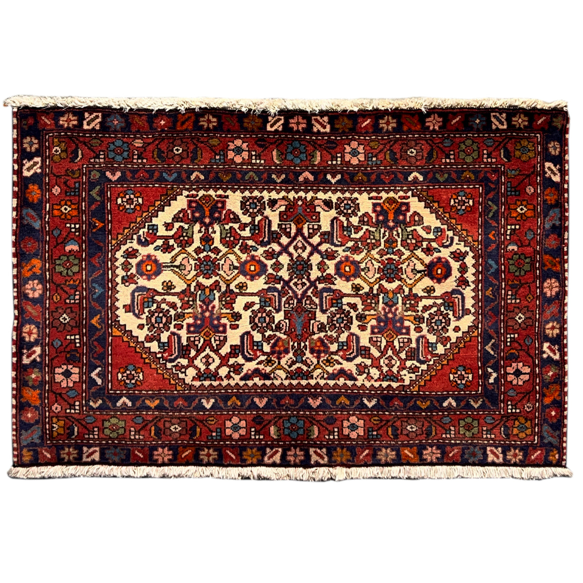 Red Poshti rug with an ornamental pattern, dark border, and light-colored fringes
