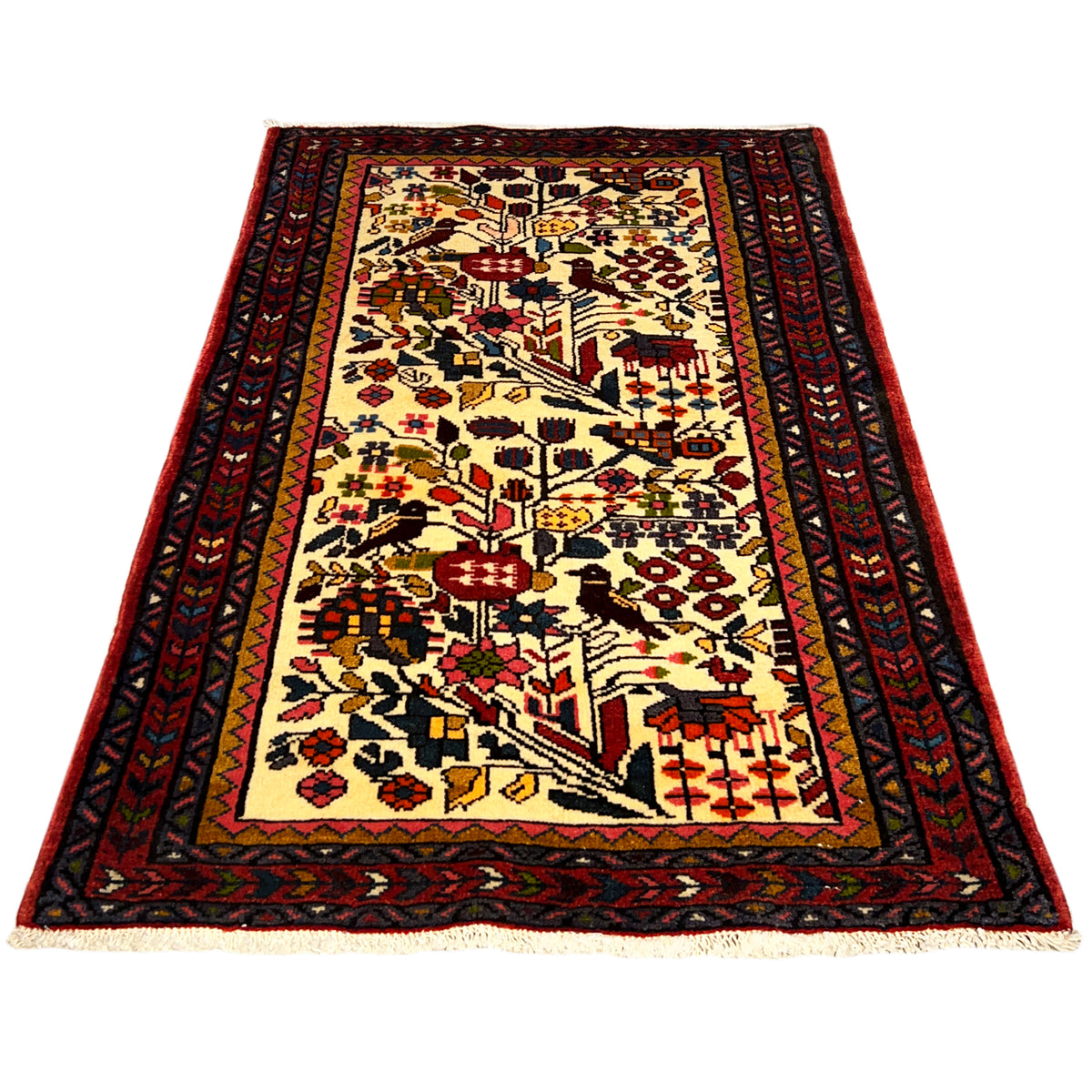 Colorful Poshti rug laid flat with a central motif in cream, red, blue, and yellow