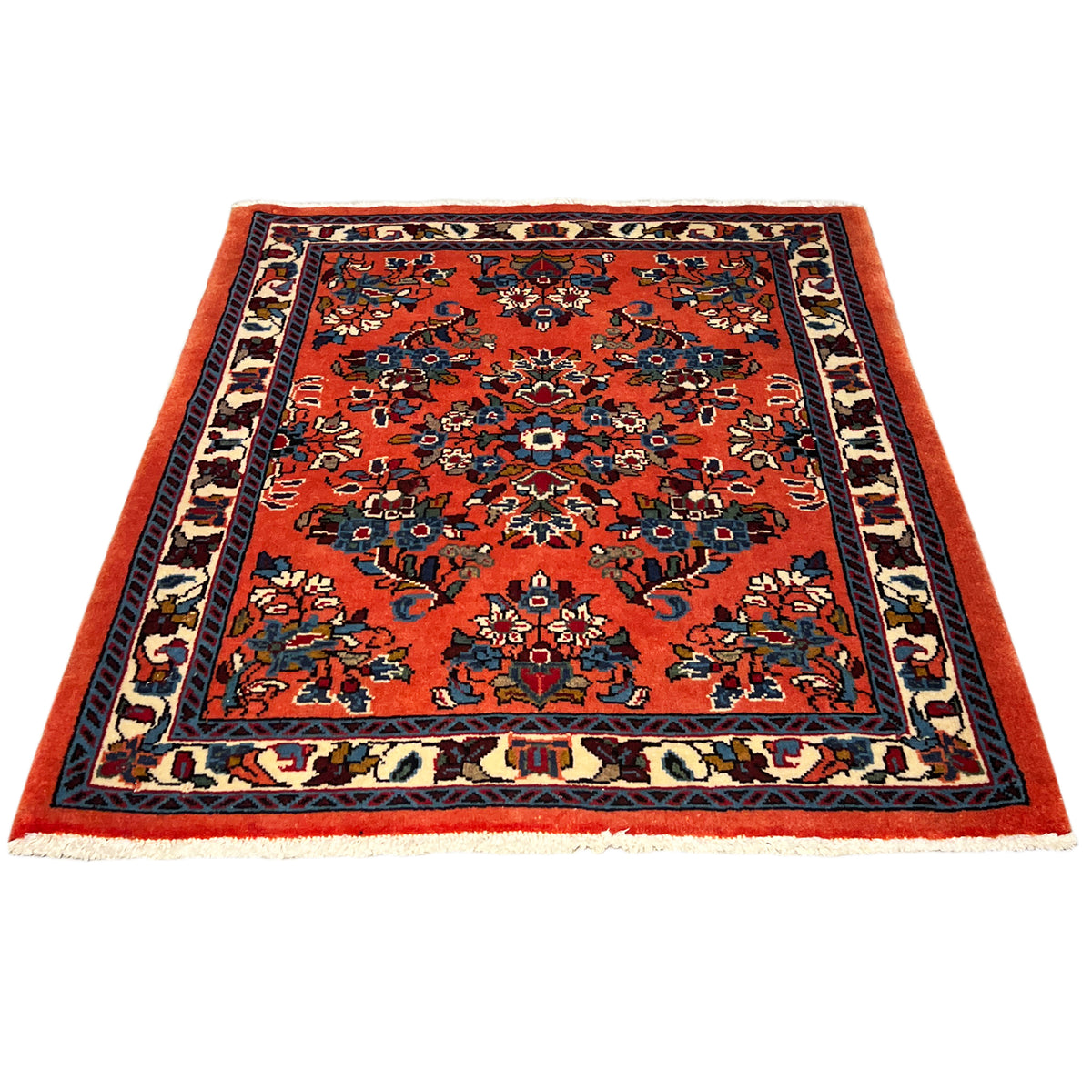 Rectangular rug with an orange design and dark blue border pattern