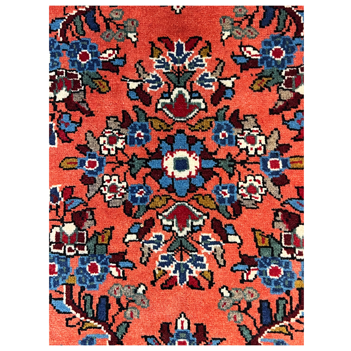 Carpet-like view: orange background with colorful floral motifs and blue-and-white accents