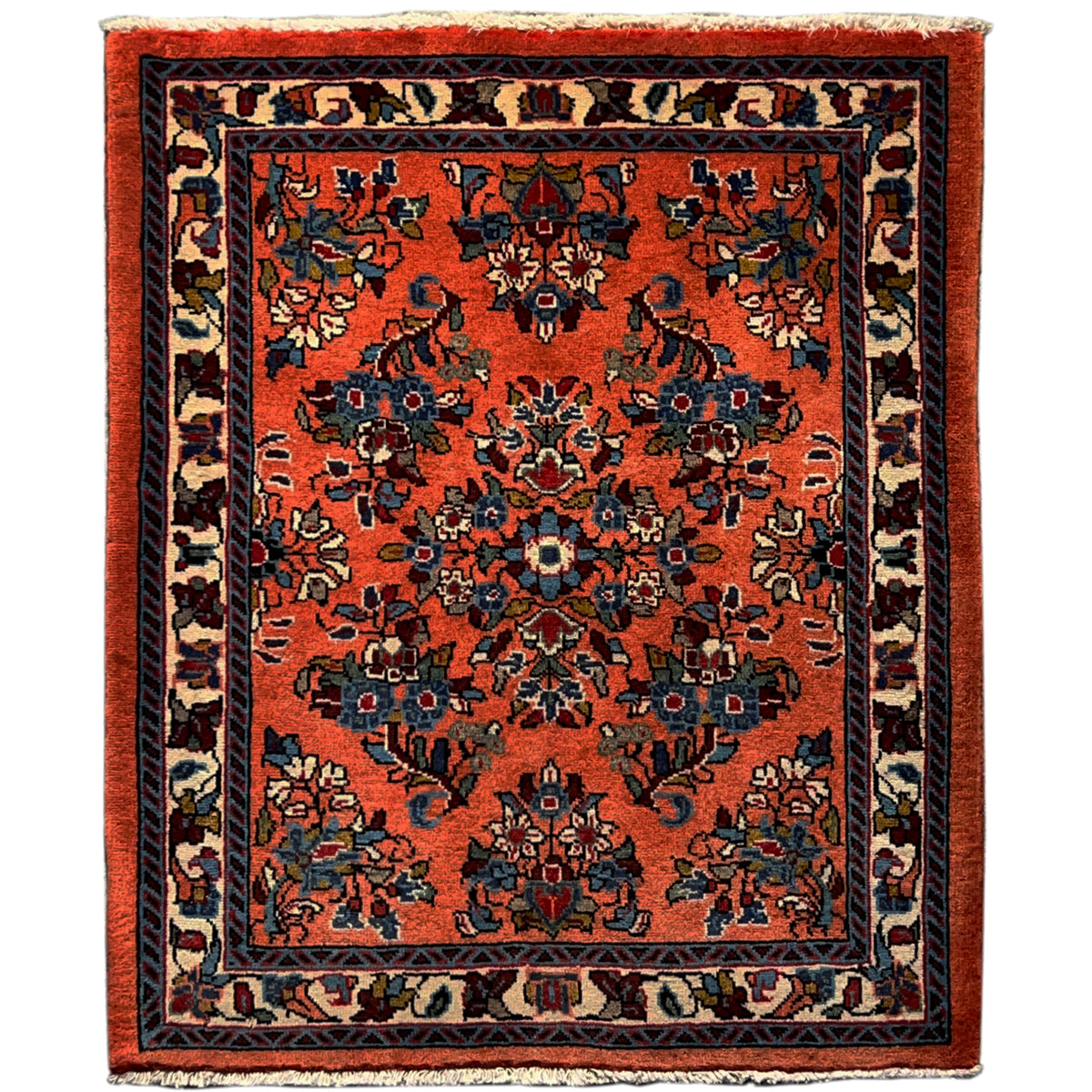 Rug with an orange base and a blue-and-black patterned medallion, rectangular