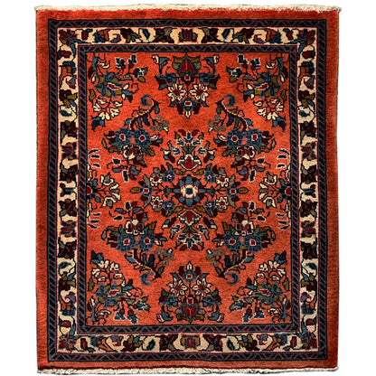 Rug with an orange base and a blue-and-black patterned medallion, rectangular