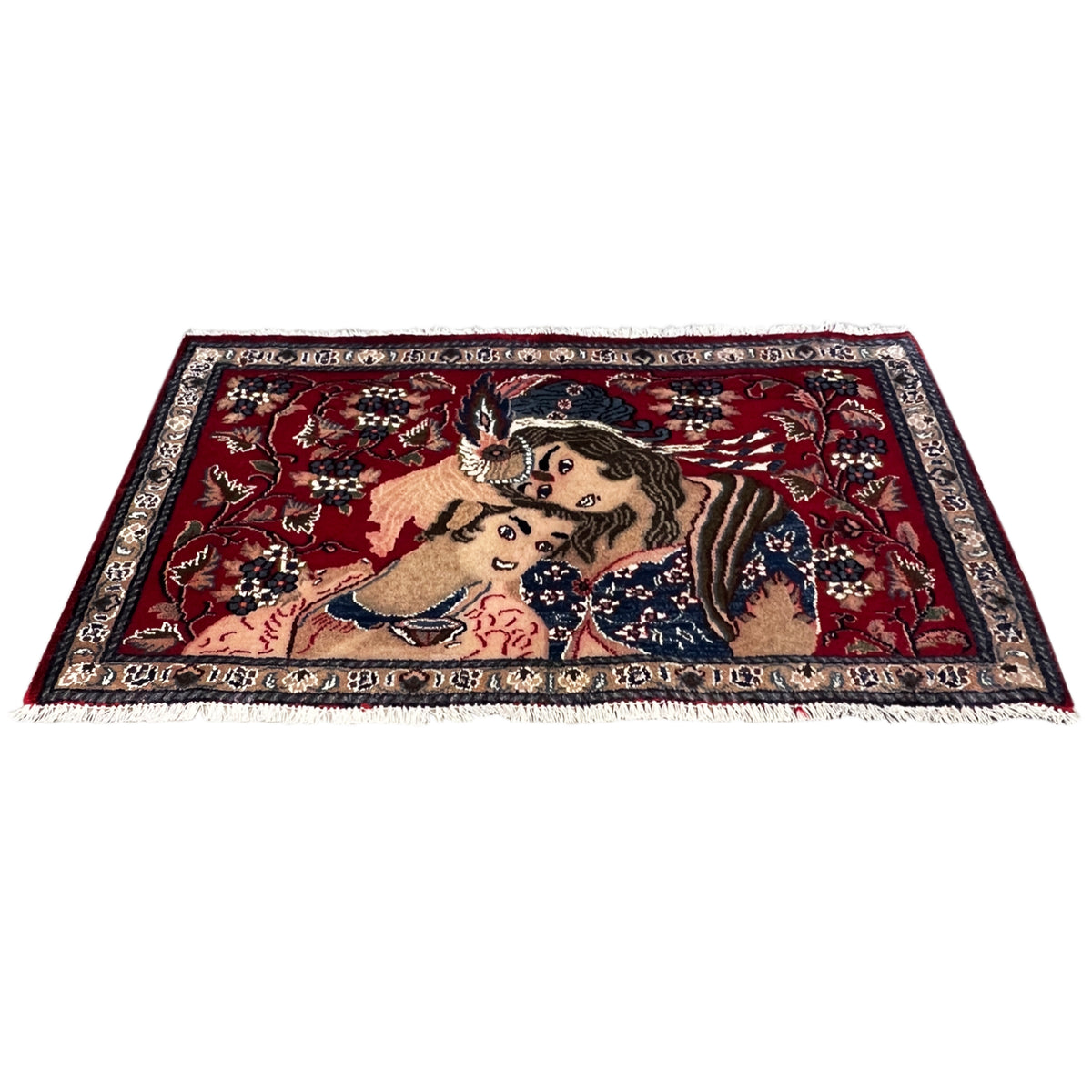 Red patterned rug with a decorative central motif and ornamental border